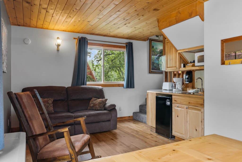 Cozy interior of Kenai River Drifters Lodge with wooden accents and relaxing living space.