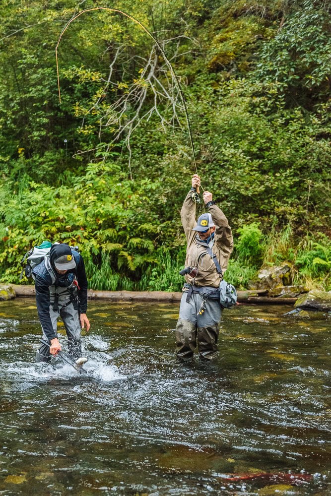 Fishing in the rushing river with 2 clients