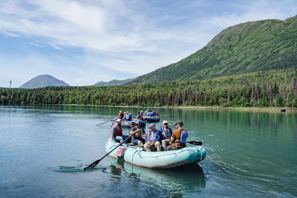 Guide with guests rafting on the kenai river | kenai river rafting
