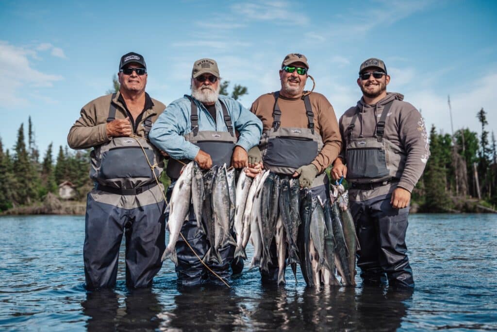 Holding sockeye salmon in the kenai rive while on an All Inclusive Alaska Fishing Vacation at Kenai River Drifters Lodge