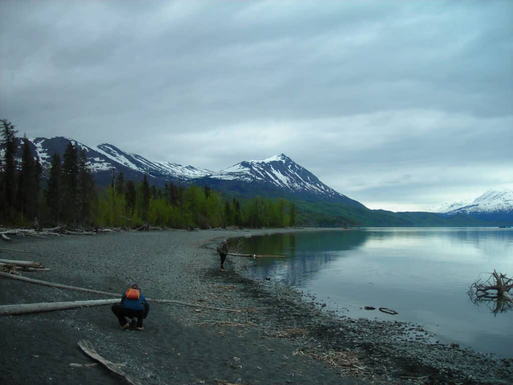 Snow-capped mountains and calm river scene at Kenai River Drifters Lodge, Alaska.