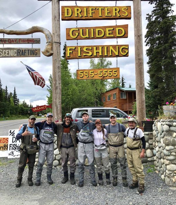 Half-day fishing and guided rafting at Kenai River Drifters Lodge, Alaska. Group of friends ready for outdoor adventure on a cloudy day.
