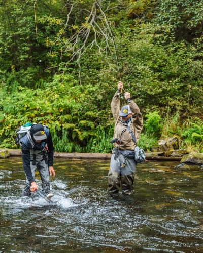 Fishing in the rushing river with 2 clients